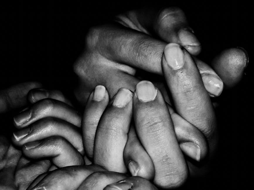 Family Holding Hands Support